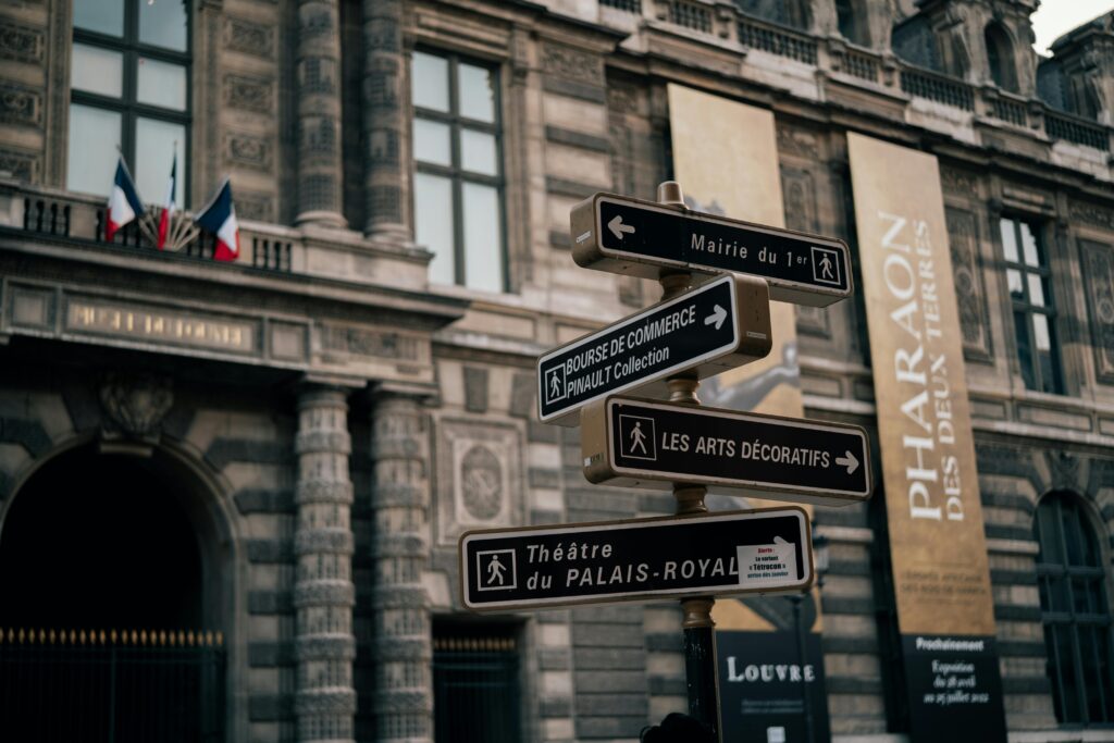 pexels photo 20170188 20170188 Street signs near historic Palais Royal in Paris, France. Architectural elegance and cultural landmarks.